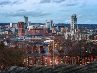 View of Skyscrapers Houses and Leeds city Under a Cloudy Sky