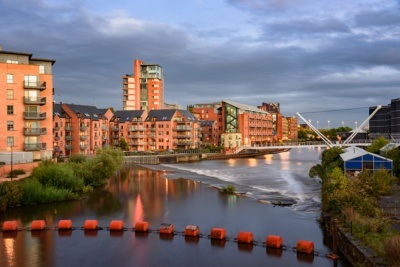 Rive Aire in the foreground with Leeds skyline behind it