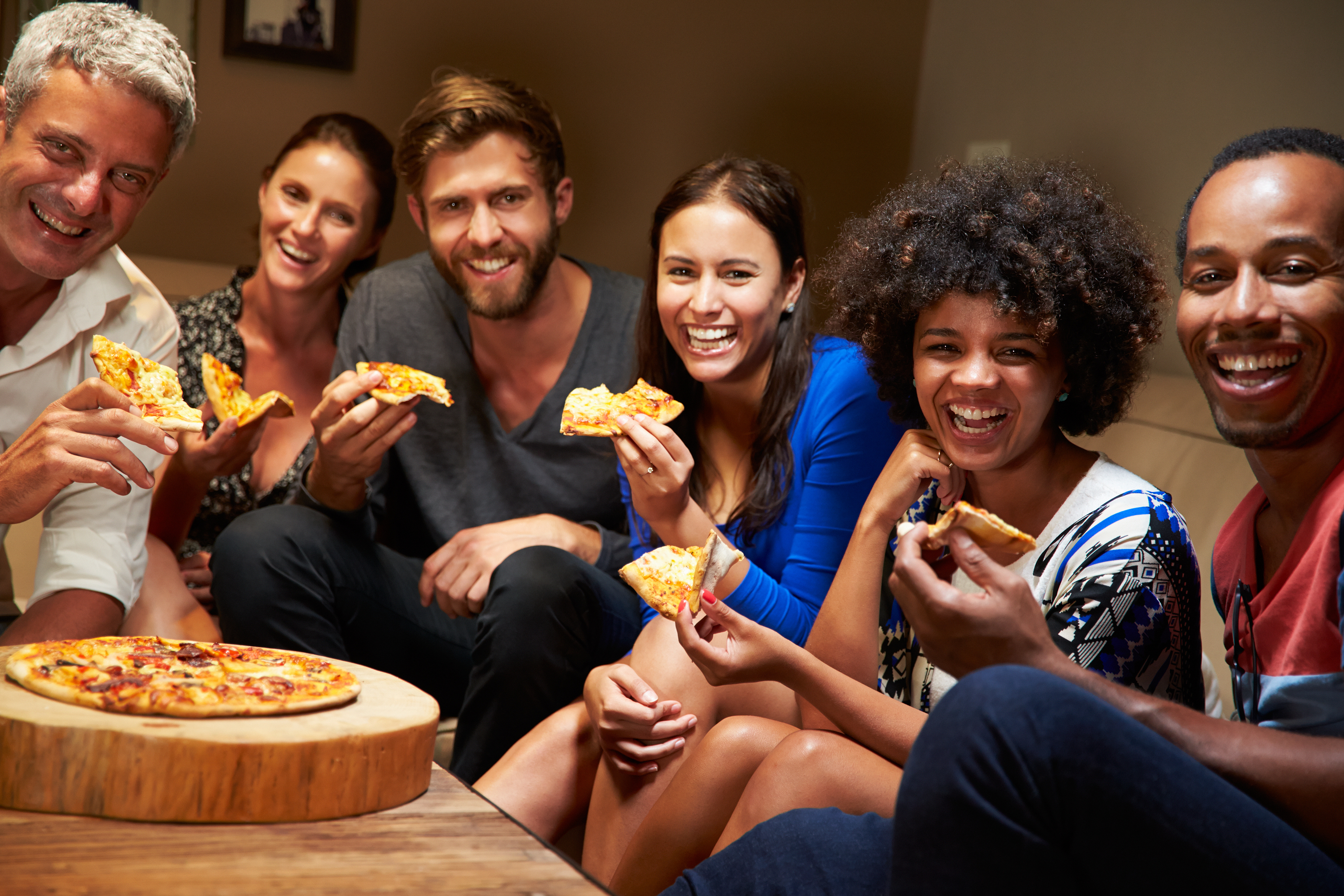 Housemates eating pizza