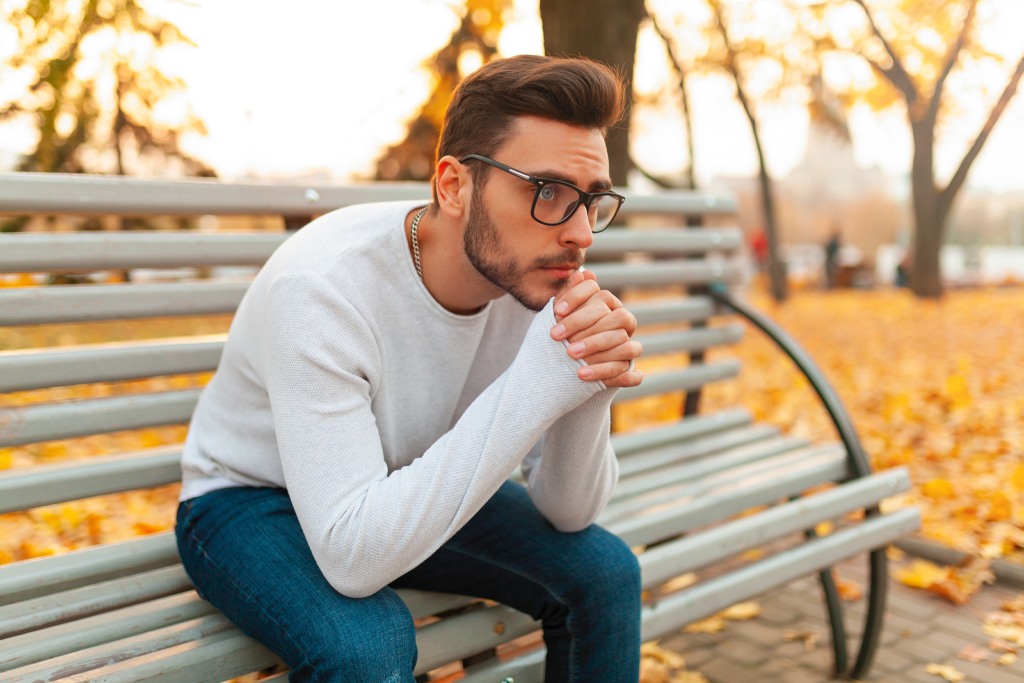 lonely student sat on a bench