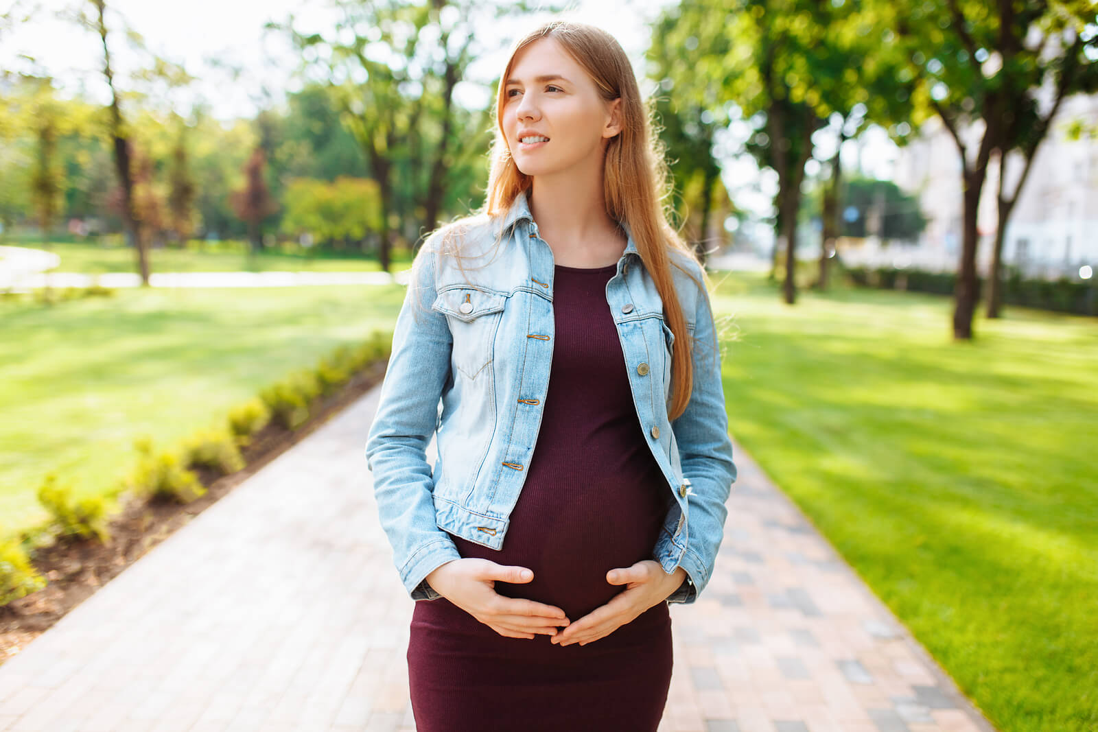 pregnant student walking in park