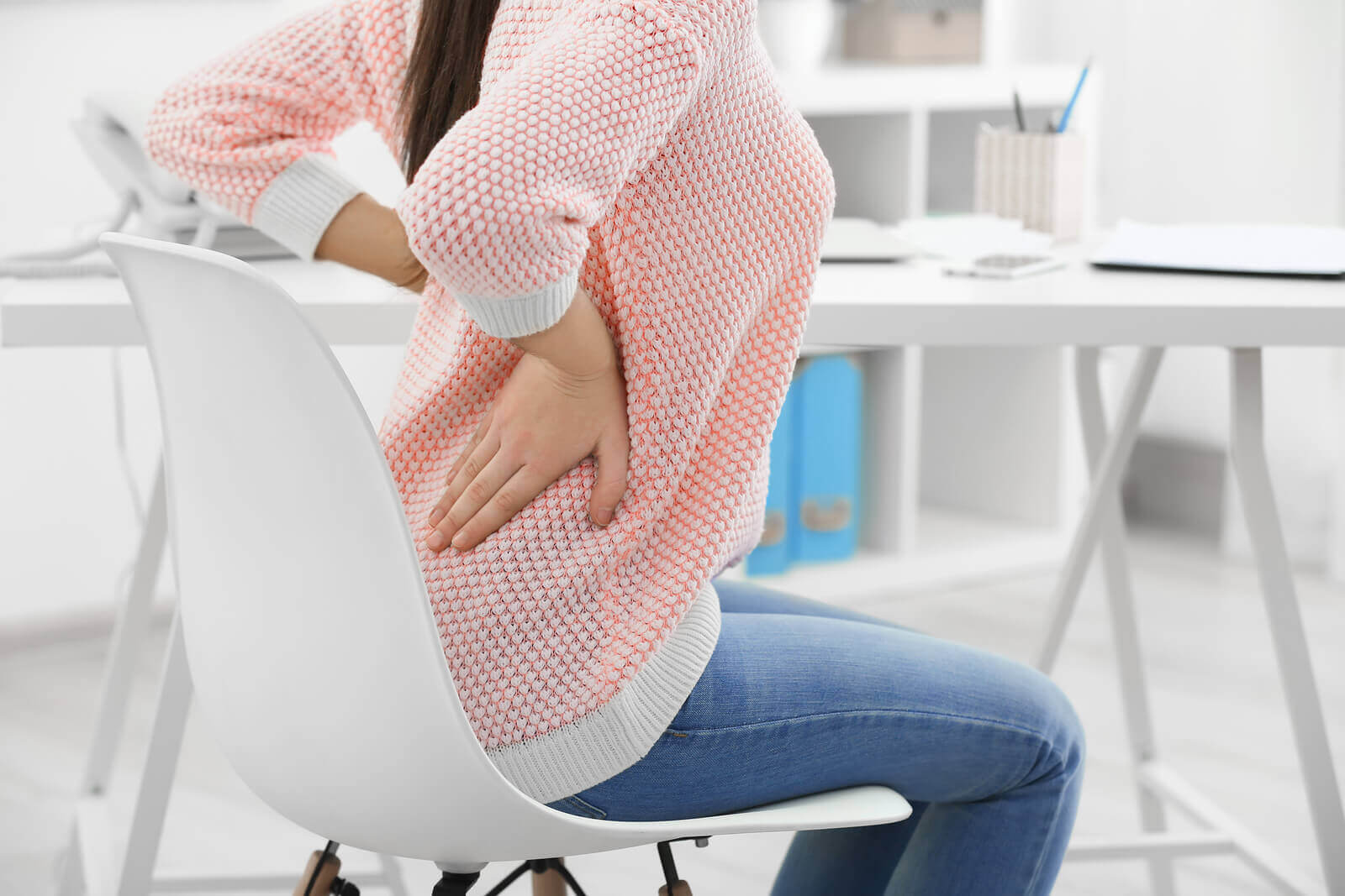 woman with back pain when working from home