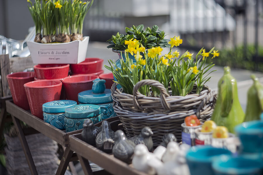 Spring homeware fair. Colorful ceramics and fresh flowers on the counter