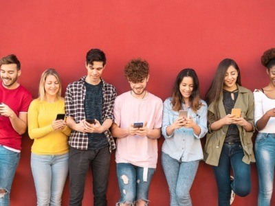 Group young friends using mobile smartphone outdoor - Millennial generation having fun with new trends social media apps -