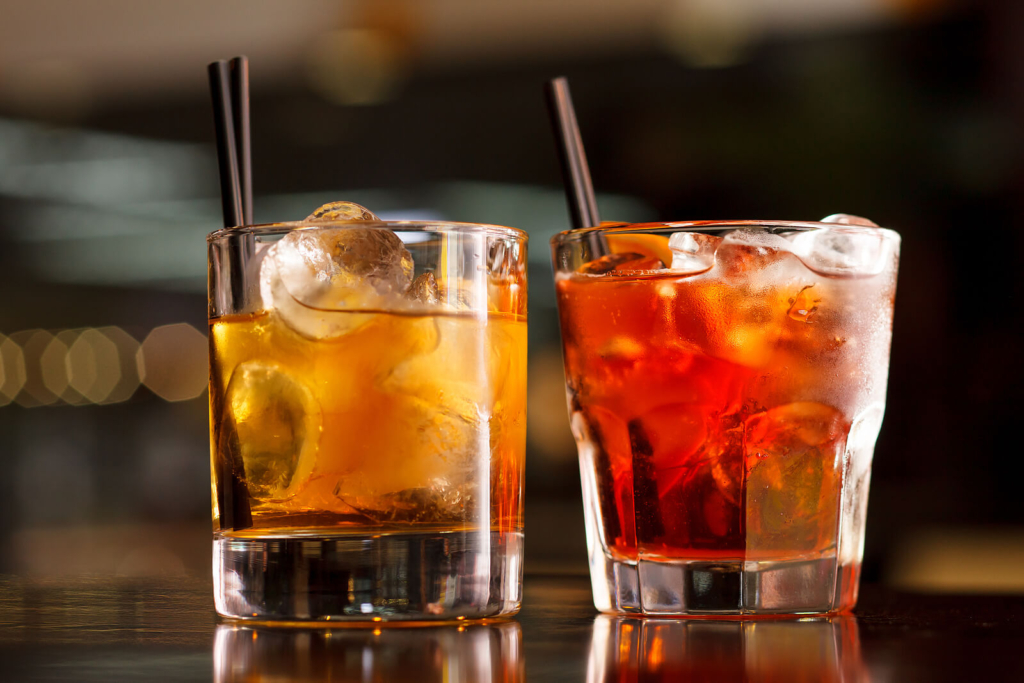 Two cocktails on a bar