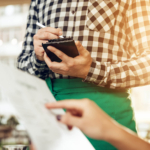 Close-up of a waiter taking an order